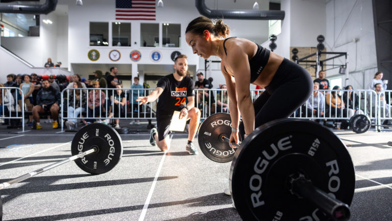 Woman deadlifting a barbell
